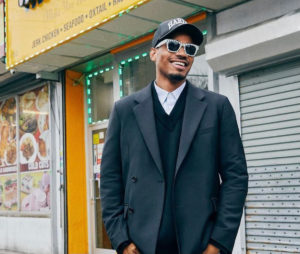 Tyshawn Jones wearing a suit