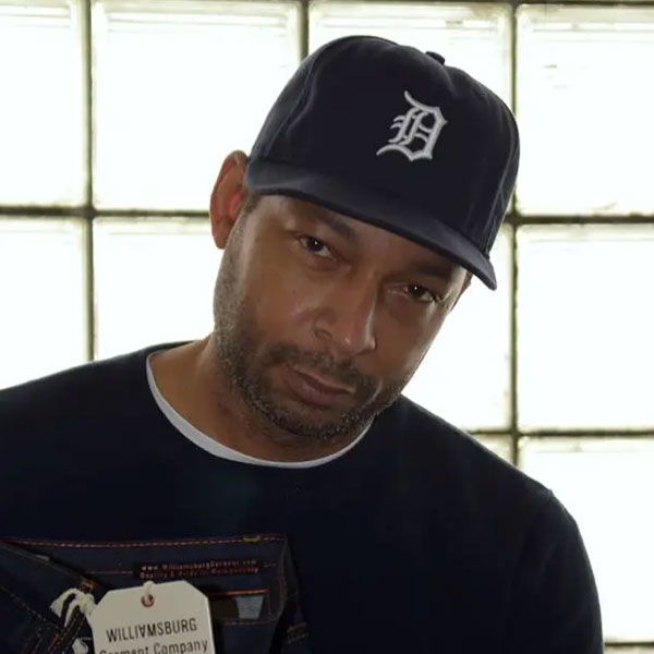 Fashion and denim designer Maurice Malone wearing a Detroit Tigers hat.