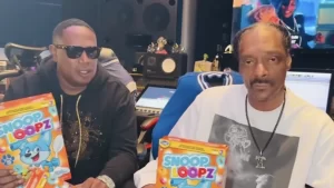 Rappers Snoop Dog and Master P, holding boxes of their new Snoop Loopz cereal in partnership with Post Consumer Brands and Broadus Foods.