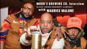 From left to right, Jamhal Johnson, Damon Patton, and Anthony Bell pose with a can of Moor's Brewing Company's IPA. They are the African-American owners of Moor's Brewing Co., a black-owned brewery headquartered in Chicago, Illinois.