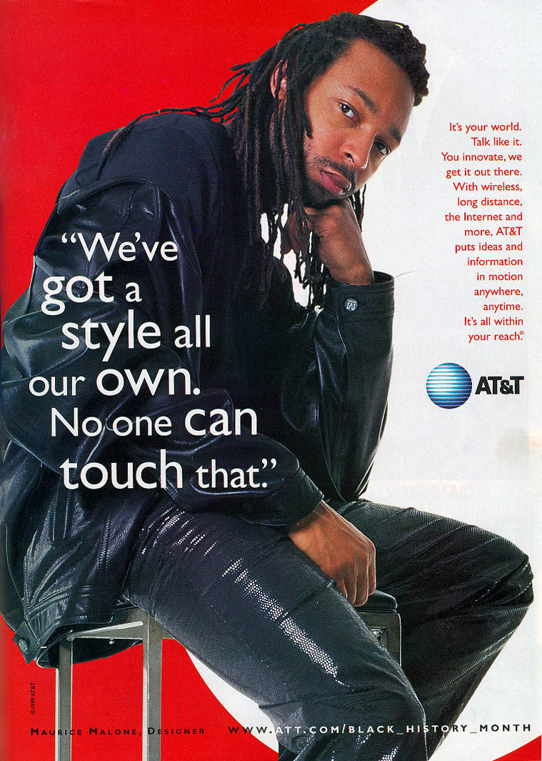 Fashion designer Maurice Malone featured in AT&T's 1999 Black History Month campaign, sitting in a chair dressed in a leather outfit, embodying individual style and innovation.