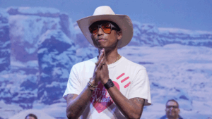 Pharrell with praying hands wearing a Human Made t-shirt